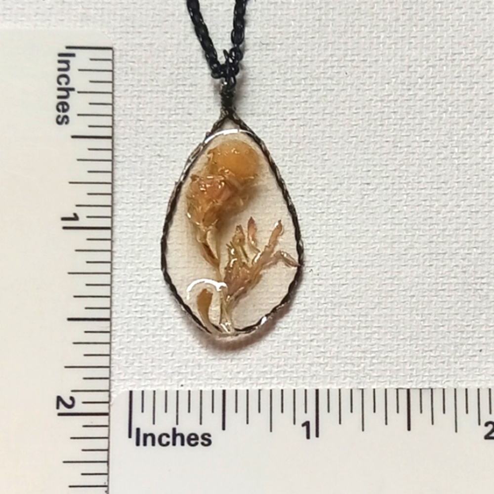 Floral necklace, amulet